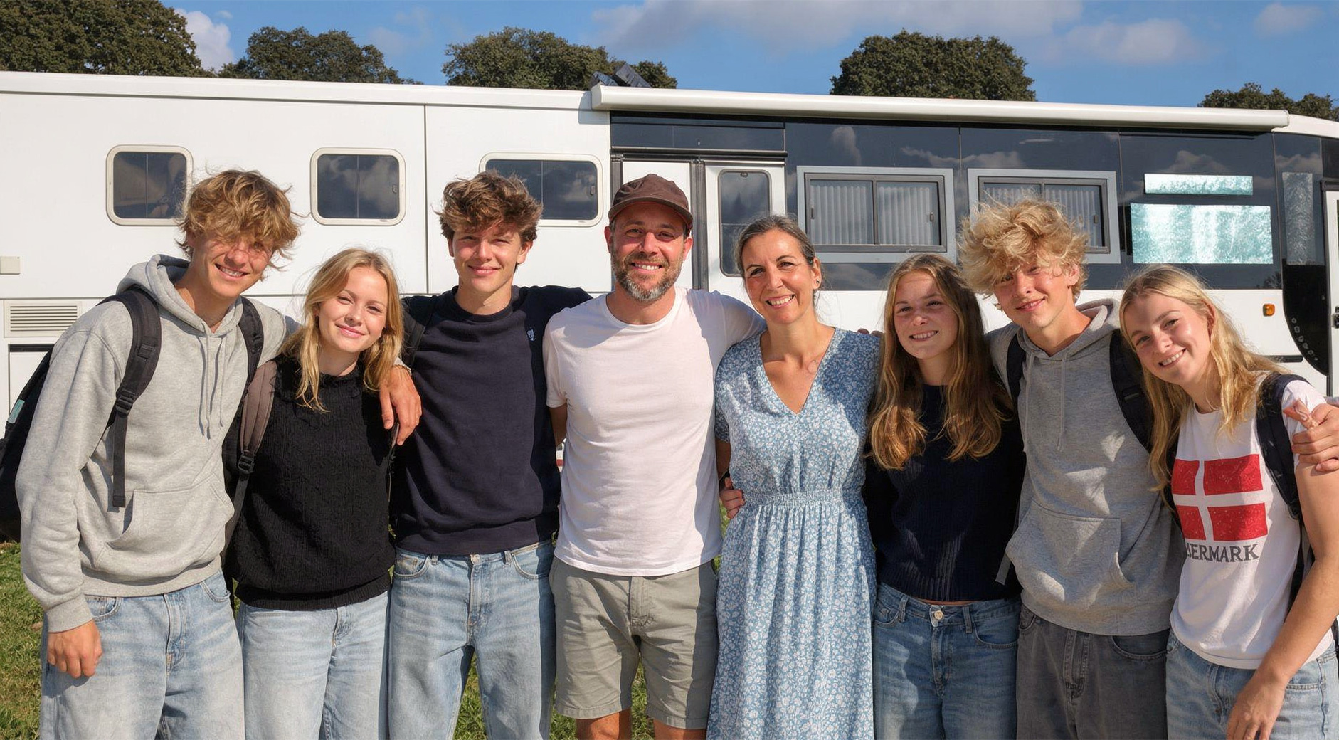Group portrait in front of the bus