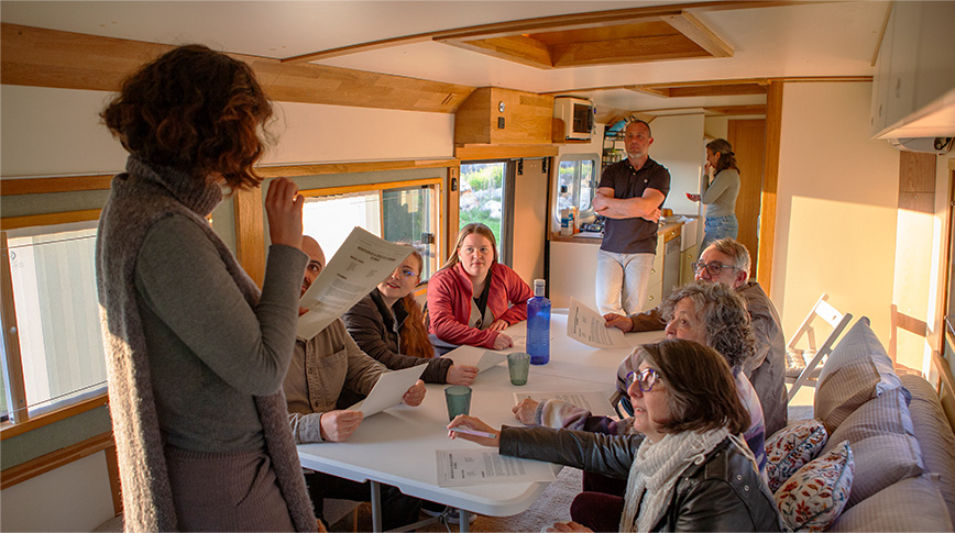 Teacher leading a class inside the bus